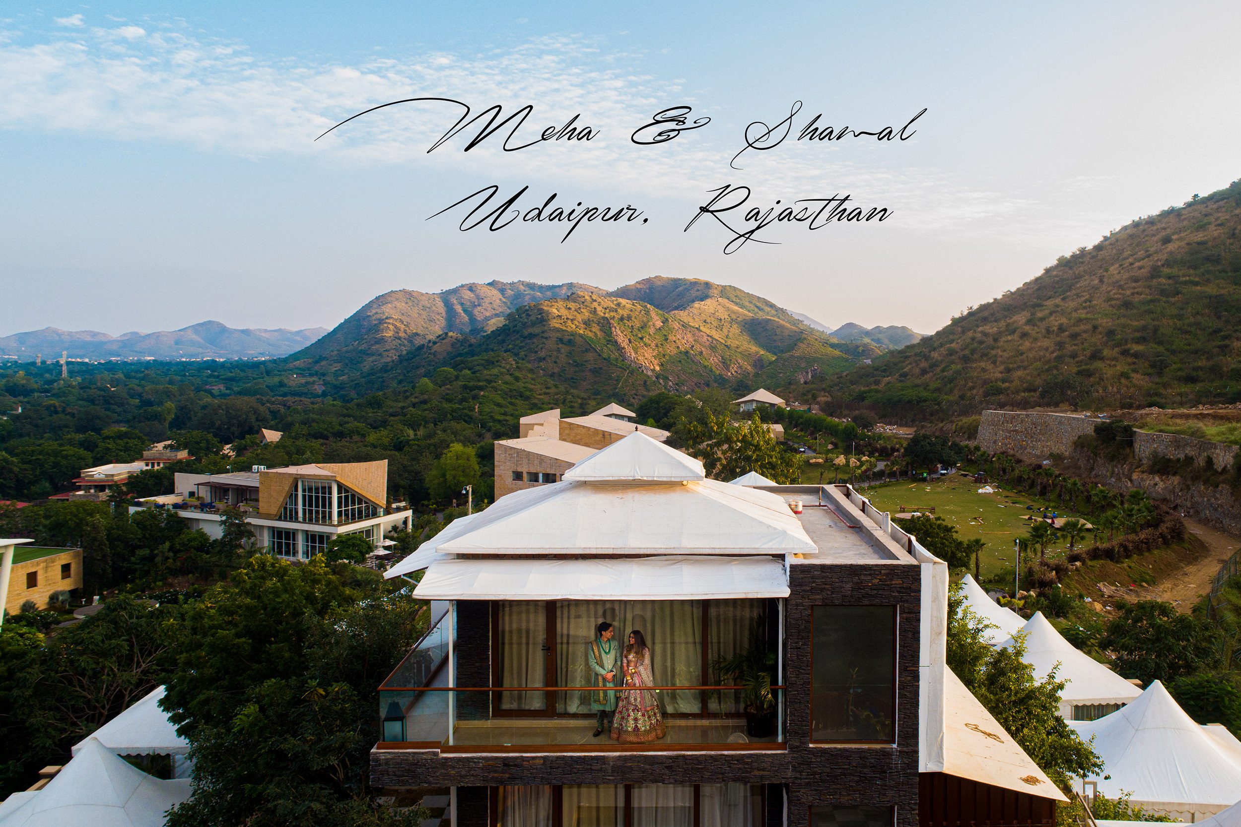 Aerial photo of bride and groom with mountain in the background at Taj Aravali Udaipur