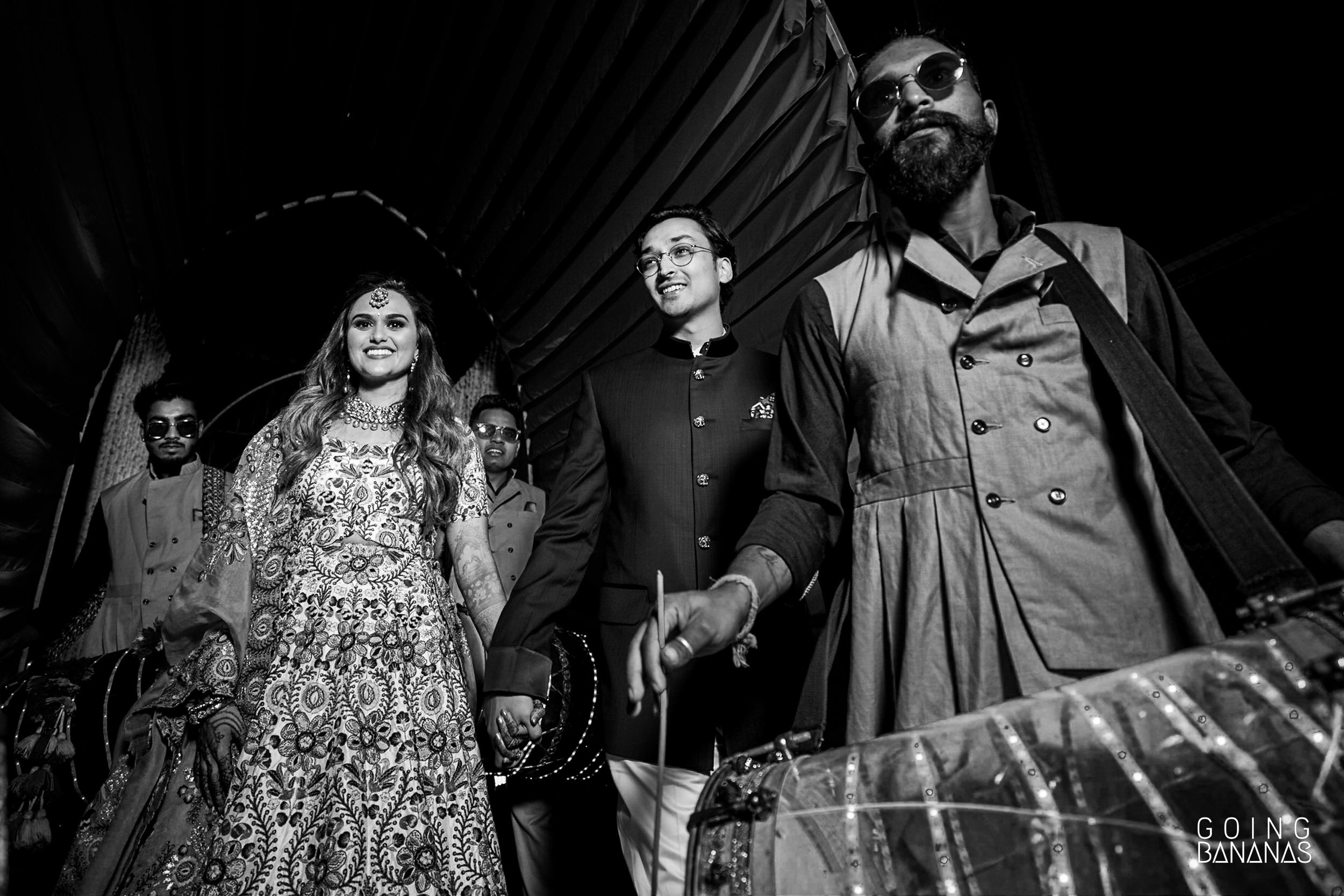 Bride and groom enter the sangeet at Taj Aravali Udaipur with dhol