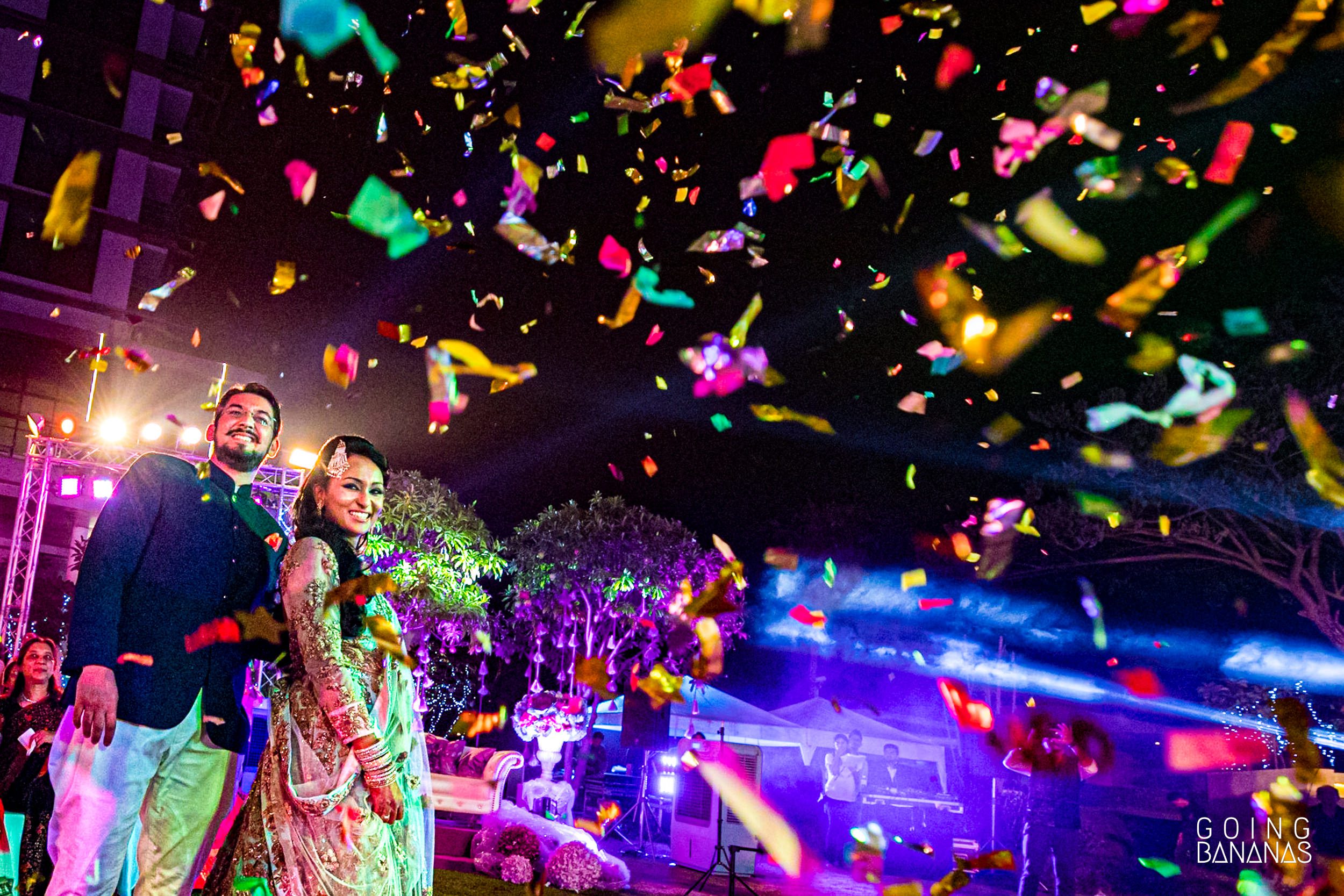 Bride and groom entering the sangeet venue with confetti at Marriott Rayong Thailand