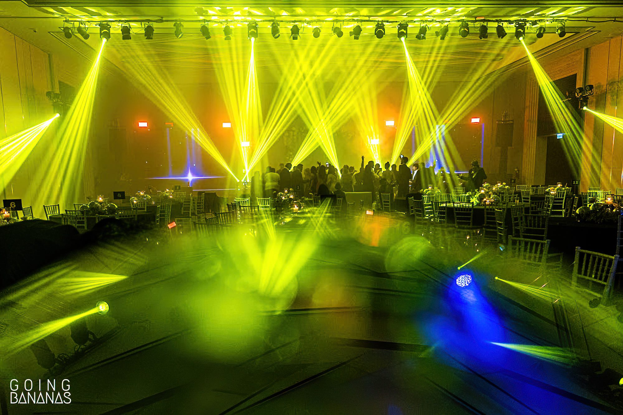Friends and family dancing at the wedding reception at JW Marriott Khao Lak Thailand