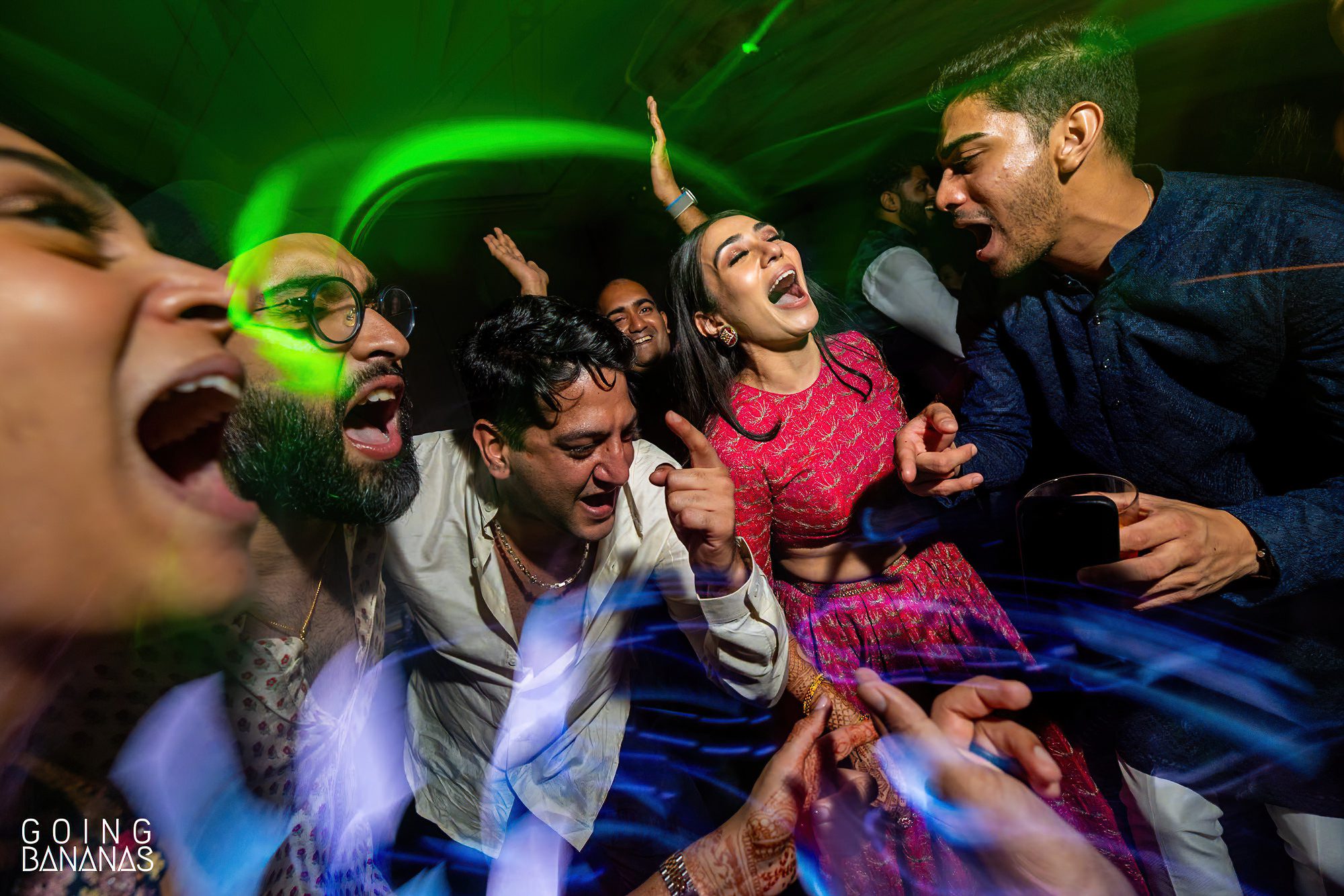 Friends and family having fun at the sangeet at JW Marriott Khao Lak Thailand